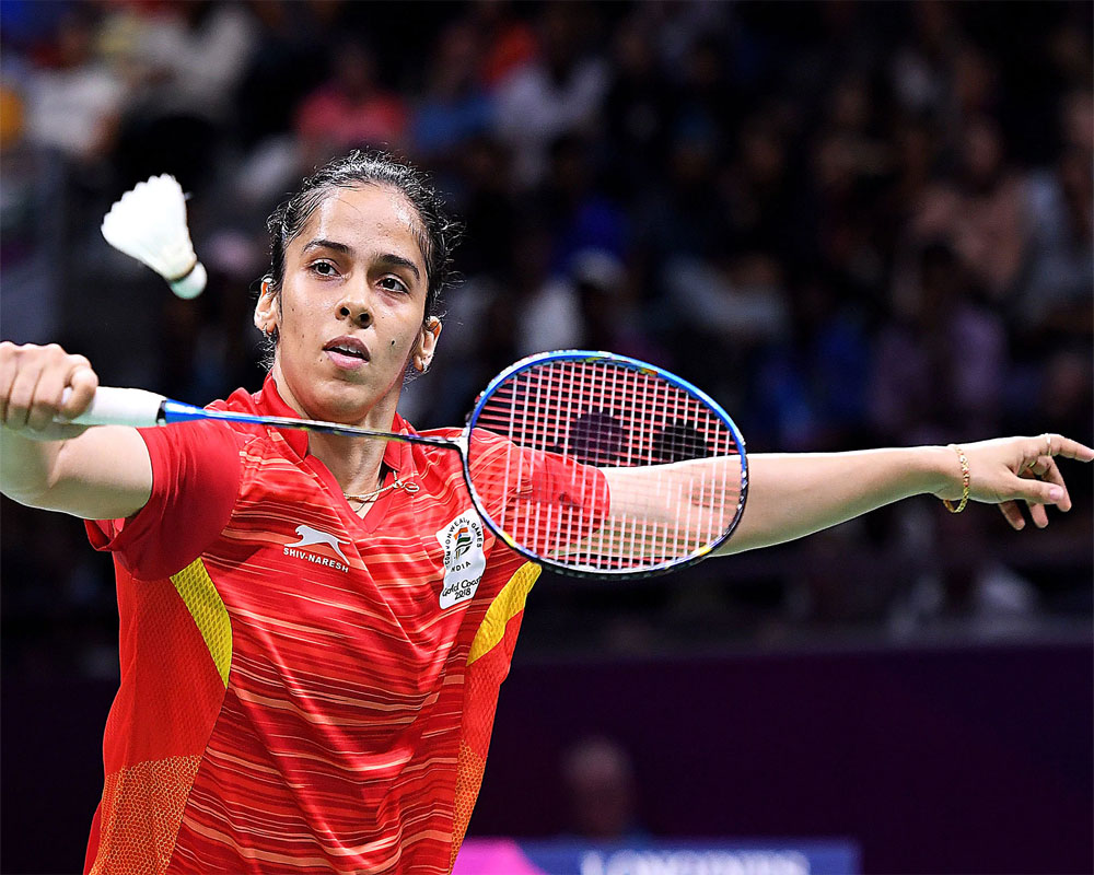 Fighting Saina moves ahead, Sindhu makes shocking first-round exit from Denmark Open