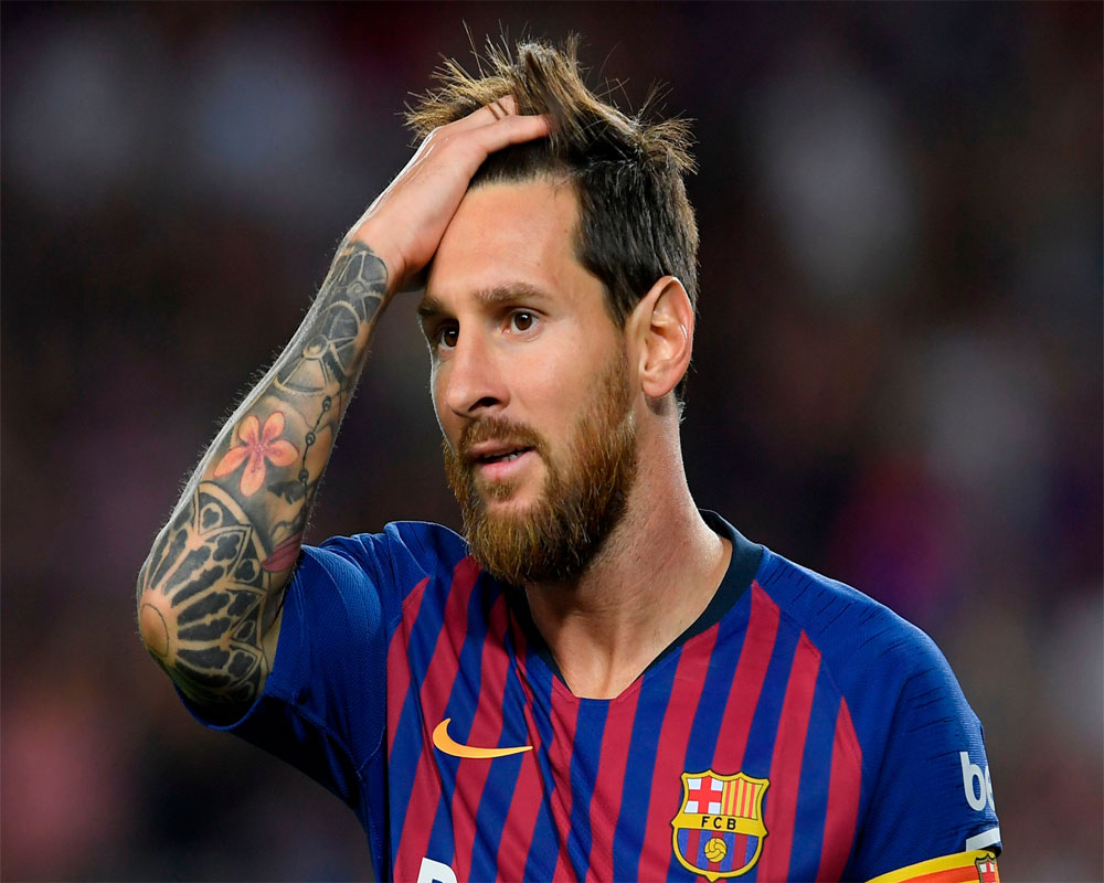 Messi's free-kick magic keeps Barca top