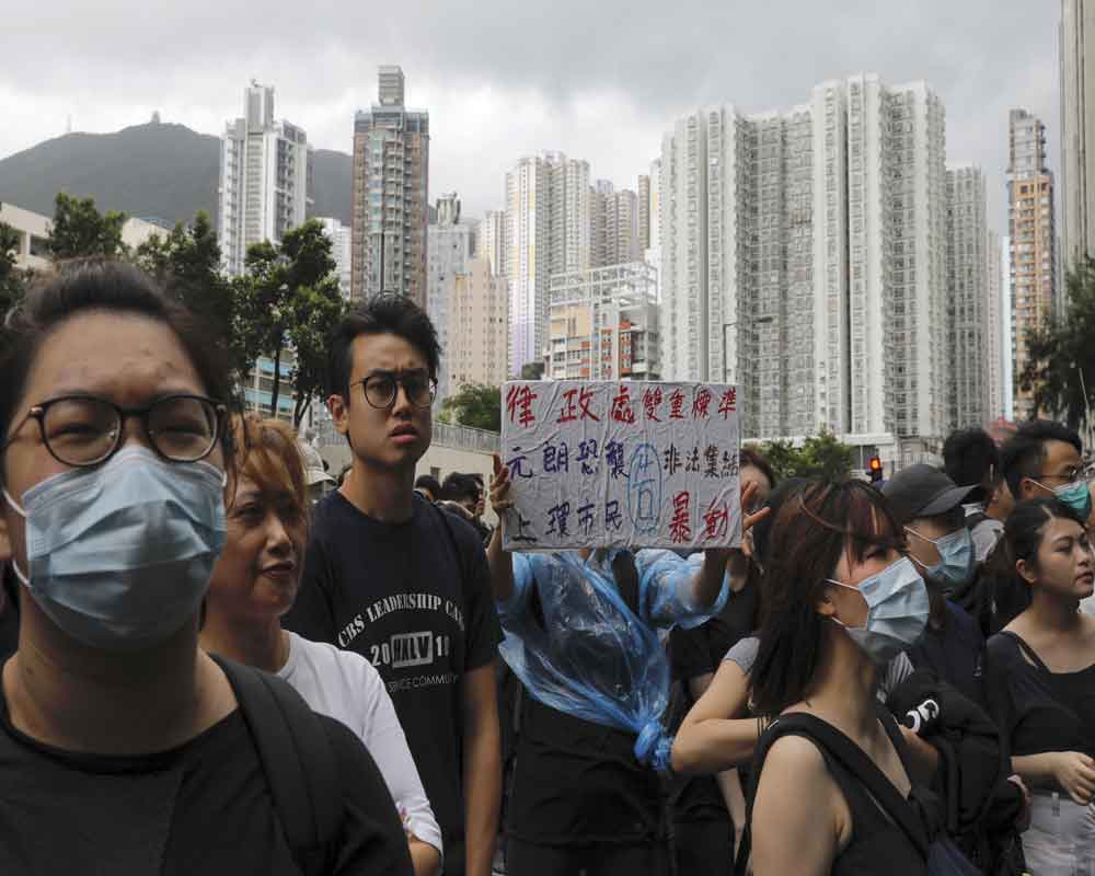 More than 20 charged with rioting appear in Hong Kong court