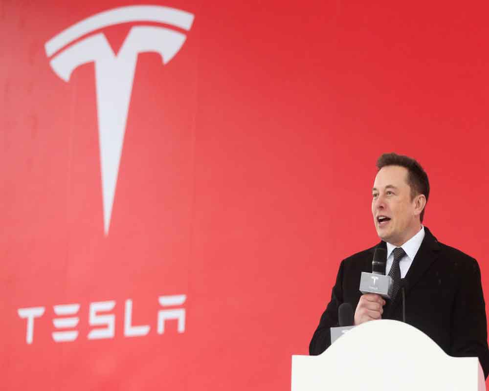 Tesla logs profitable quarter, Musk bullish on energy