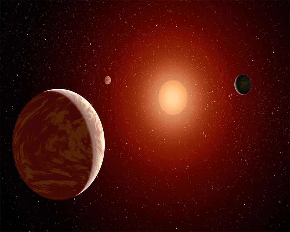 Three exoplanets discovered around neighbouring star