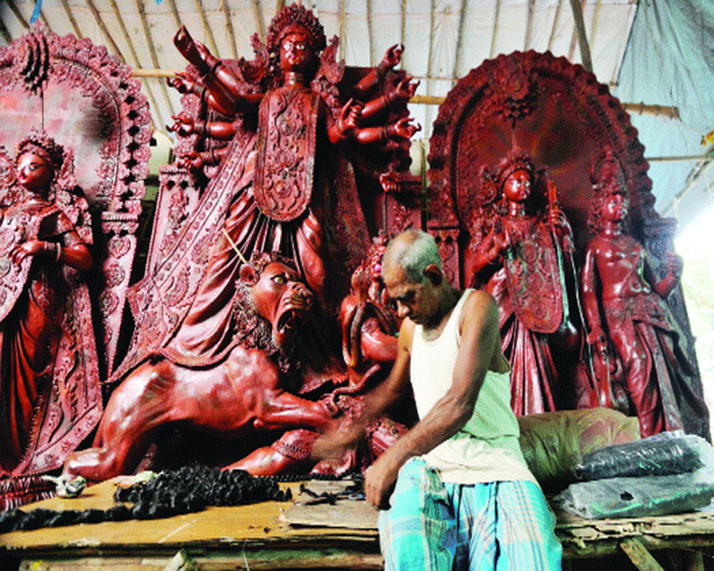 Low-key Durga idol immersion in Ichamati river under COVID shadow