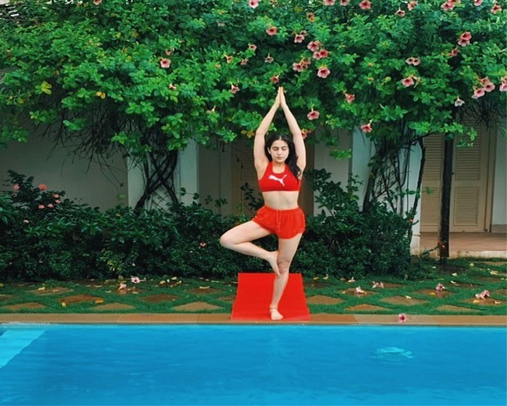 Sara Ali Khan does yoga by swimming pool