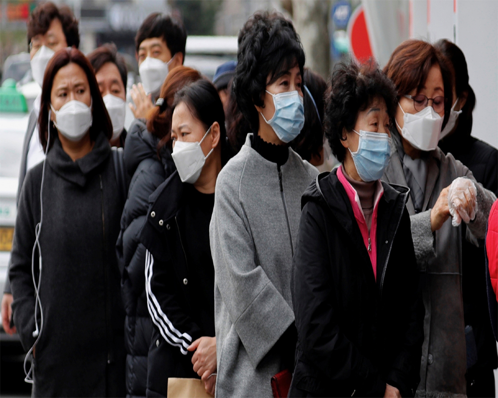 South Koreans line up for virus tests as cases surge