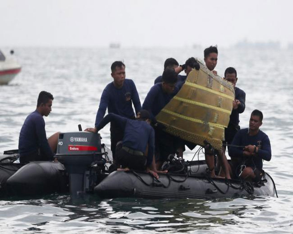 Indonesia intensifies search for crashed plane's black boxes