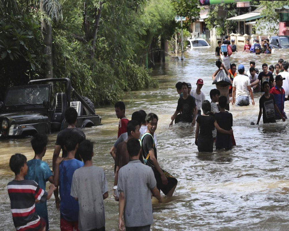 Indonesia landslides, floods kill 55 people; dozens missing