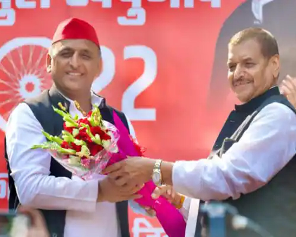 Akhilesh presents SP flag to PSPL founder Shivpal Singh Yadav, indicating possible merger of parties