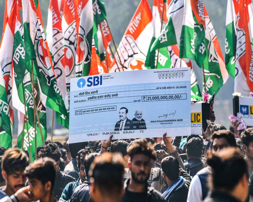 Adani crisis: Cong stages demonstration outside SBI, LIC offices in Rajasthan