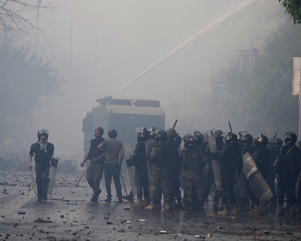 Lahore's Zaman Park under siege after clashes between police and Imran Khan's supporters