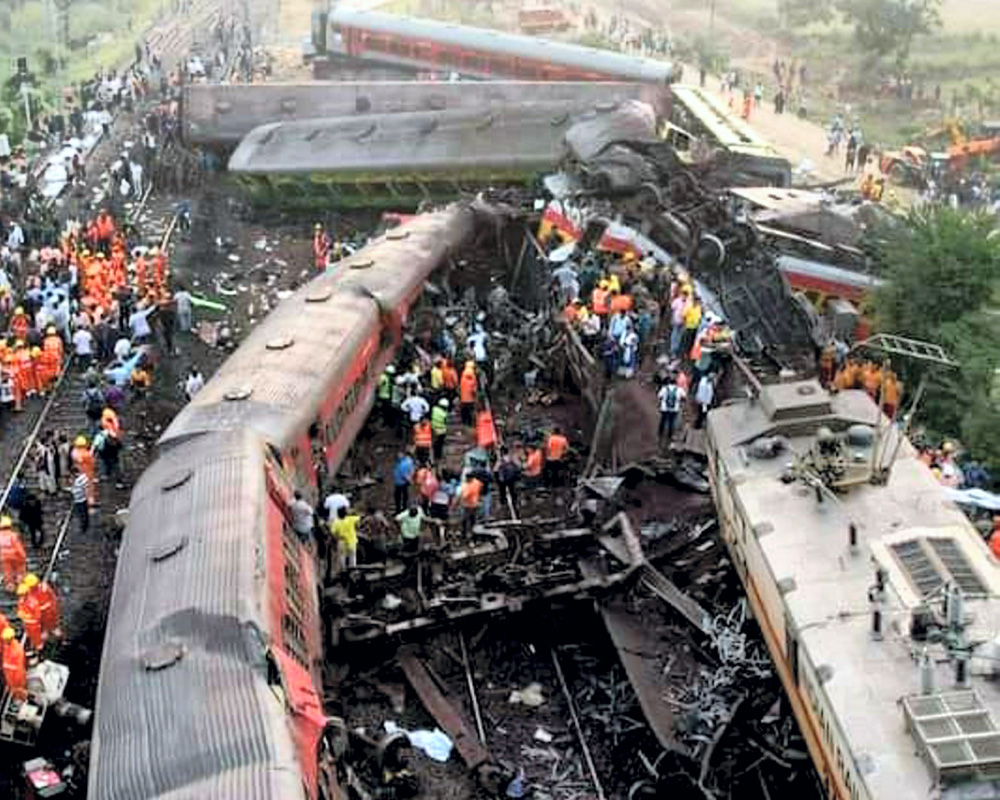 Rescuers try to raise buried coach at triple rail crash site as death toll is 261