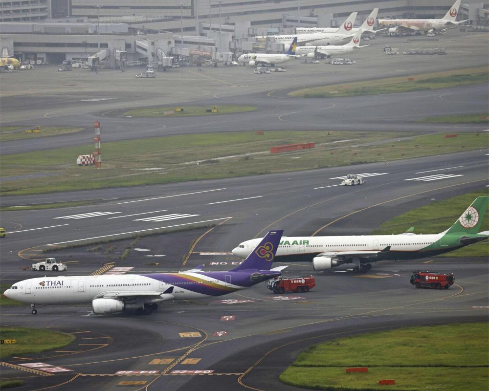 Runway closed at Tokyo's Haneda airport after 2 jets accidentally contact each other