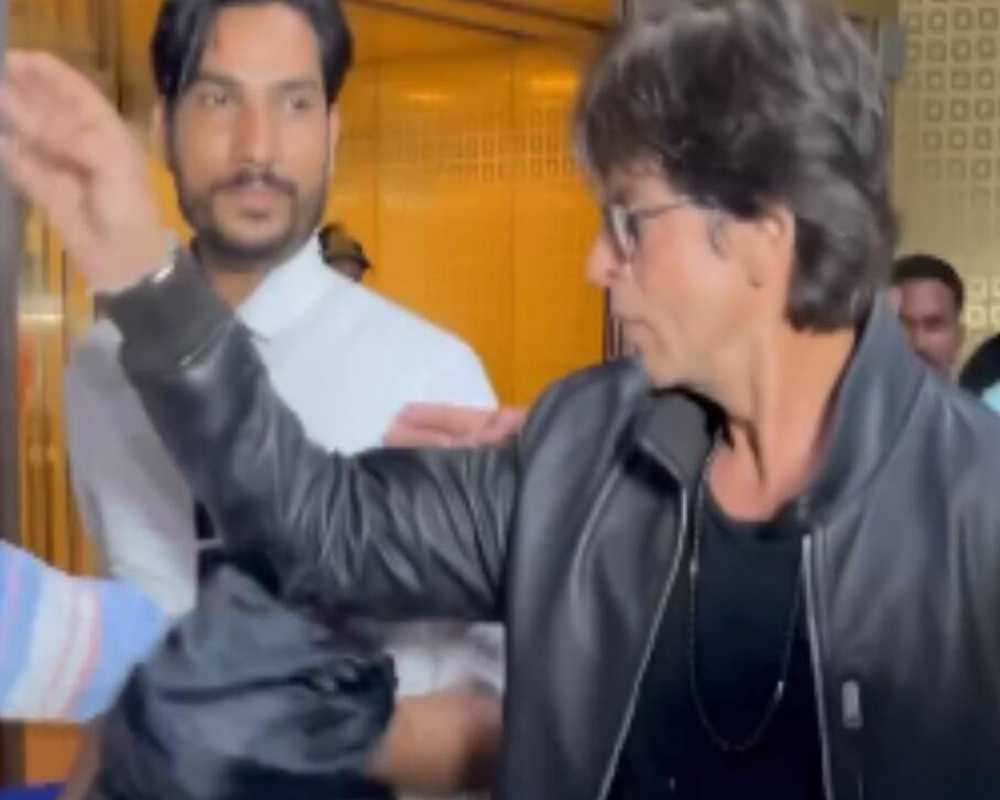 In pics: 'Pathaan' star Shah Rukh Khan shakes hands, blows flying