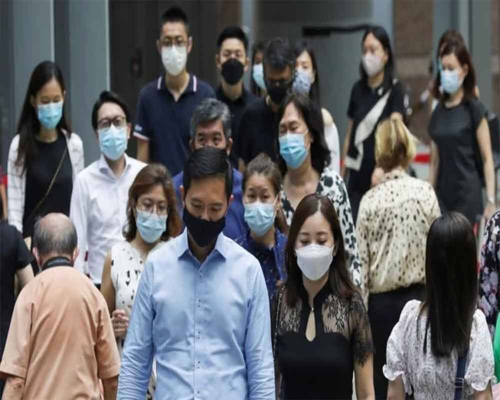 Singaporeans strongly encouraged to wear face mask following spike in ...