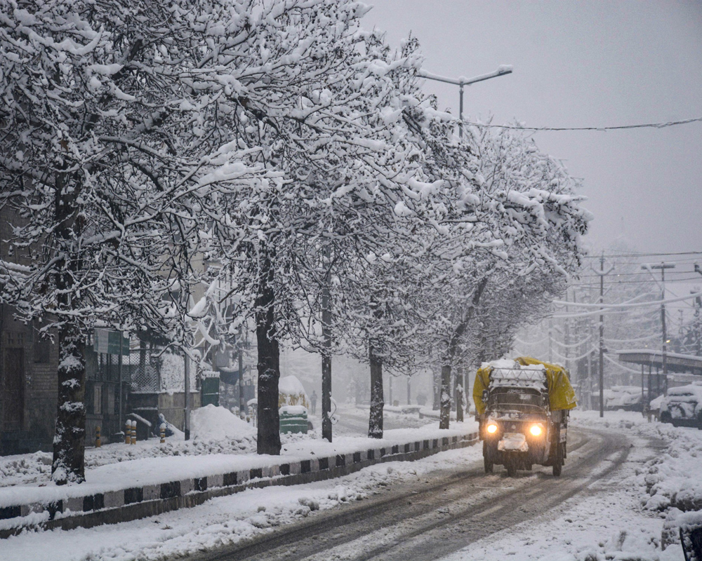 Heavy snowfall disrupts life in Kashmir; Flights, rail services suspended, Jammu-Srinagar highway closed