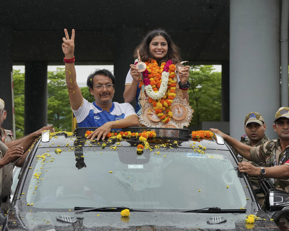 History-making Manu Bhaker arrives home to enthusiastic reception