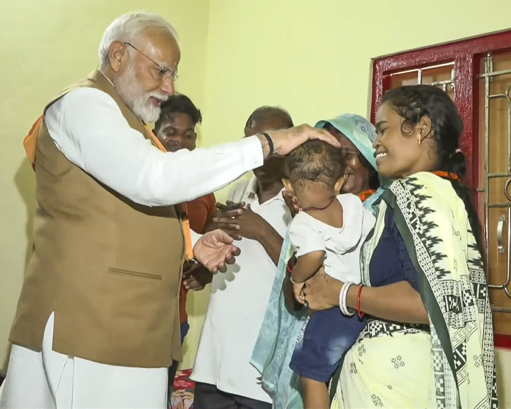 PM Modi interacts with PMAY beneficiaries in Bhubaneswar slum