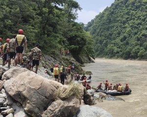 Rescuers in Nepal recover 7 bodies after a landslide swept 2 buses of people into a river
