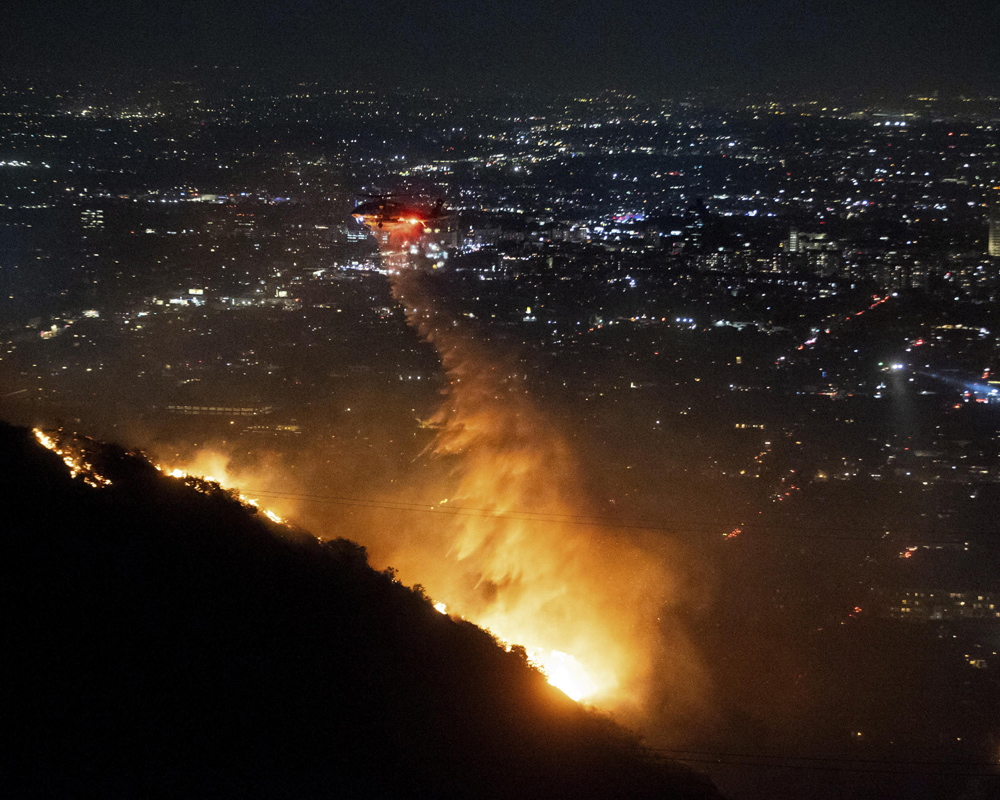 Tens of thousands ordered to evacuate as fires tear through Los Angeles area