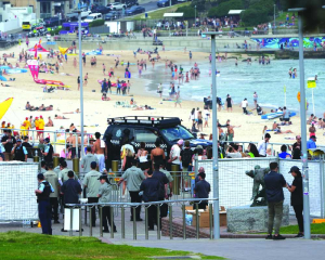 Thousands gather at Bondi Beach to mourn for victims of antisemitic attack