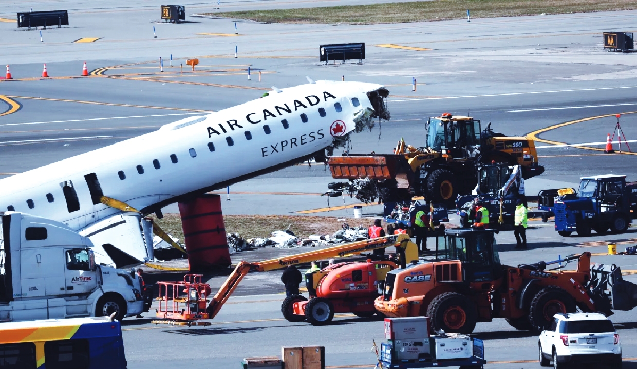 Mangled plane in LaGuardia crash towed from runway