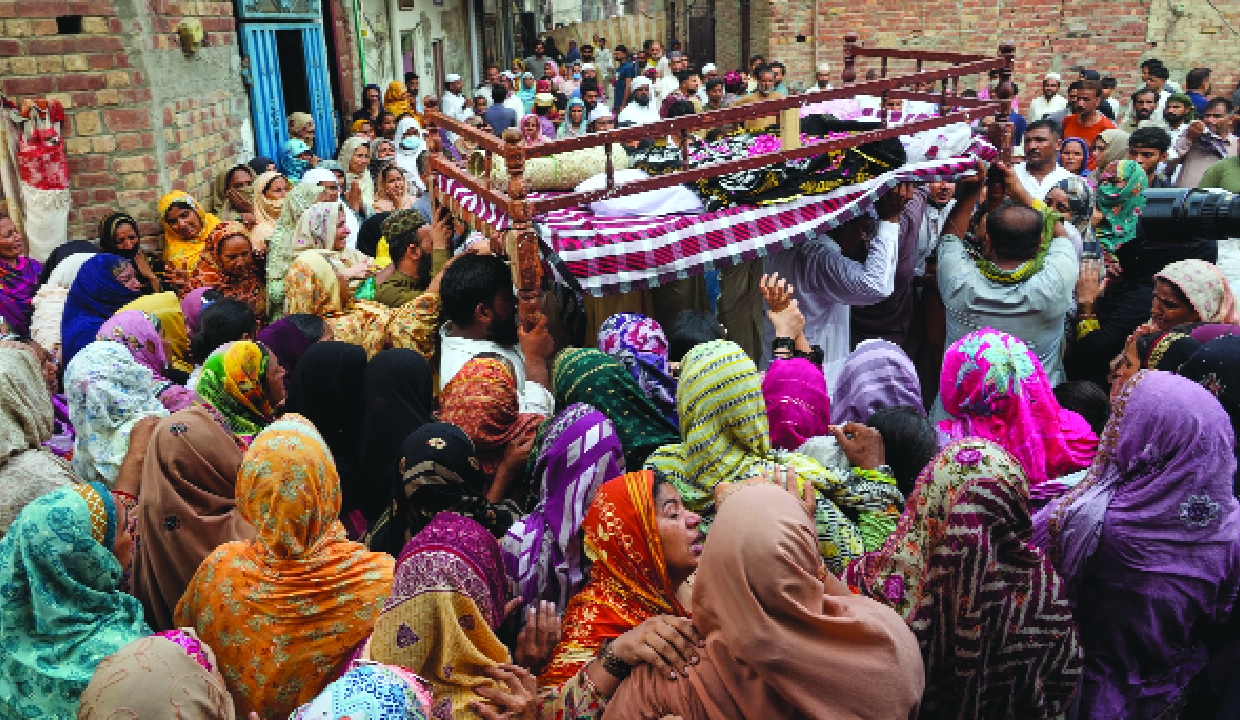 Pakistan holds funerals for 14 children after tutoring centre collapses