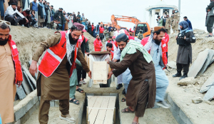 Afghans hold mass funeral for airstrike victims