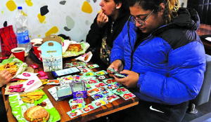 Argentine plazas buzz with WC sticker trading fever