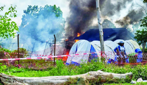 Attackers burn Ebola treatment tent in Congo; 18 suspected cases escape
