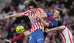 Barcelona overcomes 10-man Atletico and boosts La Liga lead