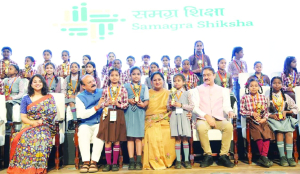 CM Rekha distributes laptops to 1,200 students