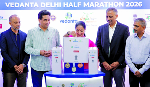 CM Rekha Gupta unveils finisher medal for Vedanta Delhi Half Marathon 2026