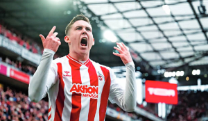 Cologne wins Bundesliga relegation duel