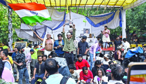 Despite crackdown, protesters rebuild stage, tents overnight