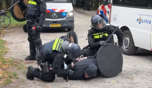 Dutch riot police break up far-right protest in The Hague after violence erupts