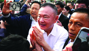 Former Thai PM freed early from parole after receiving royal pardon