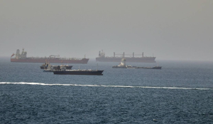 Iran fires missiles at commercial ships in Strait of Hormuz; US weighs retaliatory strikes