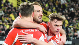 Kane scores 2 more as Bayern beats Dortmund