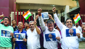 Mumbaikars gather outside pilot Smit Machchhar’s home