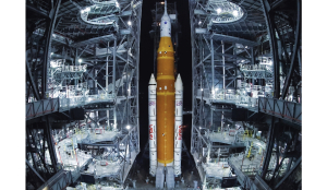 NASA hauls its repaired moon rocket from hangar back