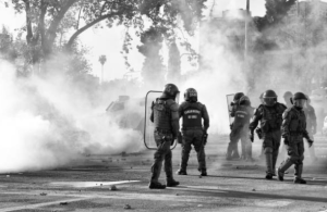 Nigeria police fire tear gas at protesters over deaths of miners in custody