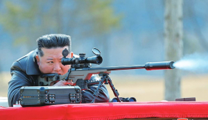North Korea’s Kim gifts rifles to officials and his daughter takes aim after party congress