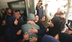 Palestinians bury pregnant woman killed in strikes