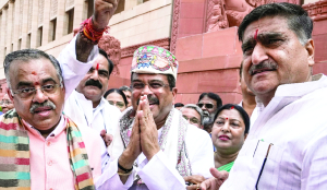 Pradhan gets hero’s welcome at Parliament