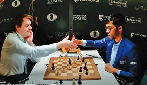 Praggnanandhaa held by Bluebaum