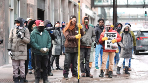 Pro and anti-ICE demonstrators face off during Minneapolis immigration