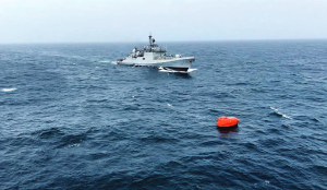 Searchers find one crew member from capsized ship