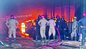 Two separate factory fires, six injured after panic jump