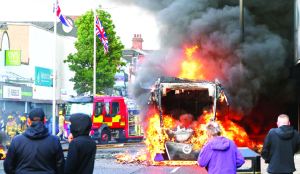 UK leaders urge calm after Belfast stabbing sparks protests