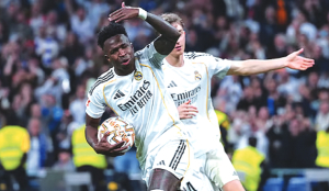 Vinicius scores twice to lead Real Madrid to a pulsating 3-2 win over Atletico in La Liga