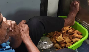 Viral Video shows Railway vendor resting feet on open Samosa crate inside train